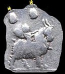 On some reverse images - infant genius riding a goat, caps and stars of the Dioscuri above.